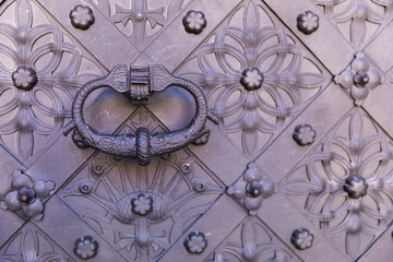 Old door with an interesting ornament, close-up.