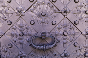 Old door with an interesting ornament, close-up.