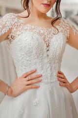 Obraz na płótnie Canvas bride in a beautiful wedding dress with lace