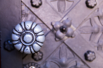 Old door with an interesting ornament, close-up.