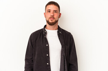 Fototapeta premium Young caucasian man with diastema isolated on white background sad, serious face, feeling miserable and displeased.