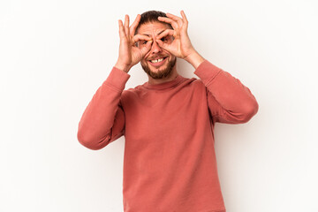 Fototapeta premium Young caucasian man with diastema isolated on white background showing okay sign over eyes
