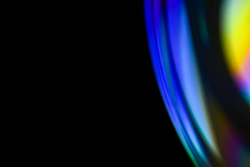 Closeup soap bubble like reflection from lens on dark background. Abstract multicolor psychedelic alien planet