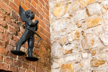 Angel figurine hung on the wall.