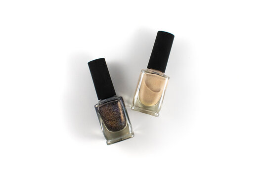 Photo of a dark grey and nude nail polish bottle 