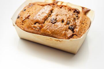Freshly made spiced fruit  loaf cake  on the white  background