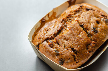 Freshly made spiced fruit  loaf cake  on the wooden background