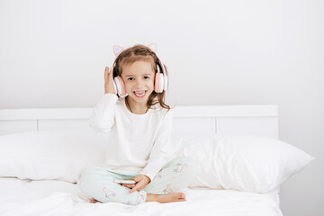 little girl with headphones