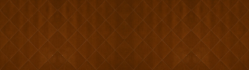 Fototapeta premium Brown caramel colored seamless natural cotton linen textile fabric texture pattern, with diamond quilted, rhombic stiching. stitched background banner panorama