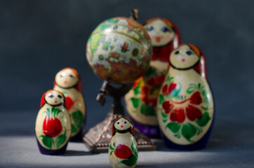 matroishka, whole family gathered next to a map, travel planning