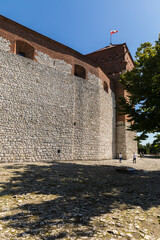 Fototapeta na wymiar Defensive walls of the ancient castle.
