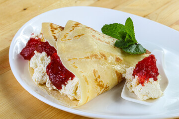 Pancake with cottage cheese and jam