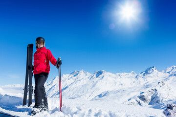 Fototapeta na wymiar Young Man On Ski Holiday In the Mountains