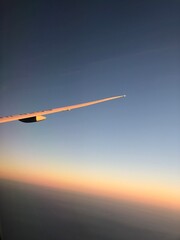 The evening sky and wings from the plane.