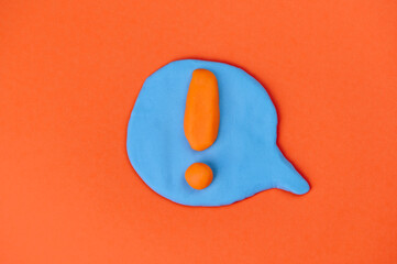 speech bubble with orange exclamation mark in the center