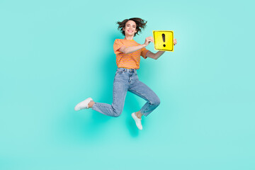 Photo of pretty cute woman dressed striped t-shirt smiling jumping rising exclamation point card isolated teal color background