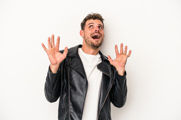 Young caucasian man isolated on white background screaming to the sky, looking up, frustrated.