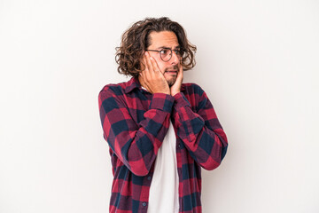 Young caucasian man isolated on white background scared and afraid.