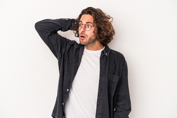 Young caucasian man isolated on white background being shocked, she has remembered important...