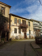 Old abandoned building and street view in the town Drama of North Greece