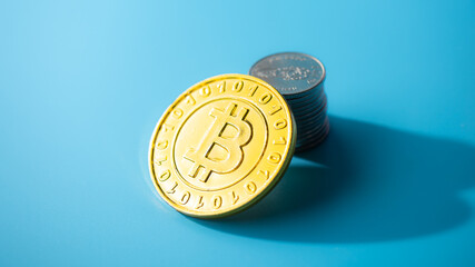 Golden bitcoin coin on cyan background . Bitcoin Gold blockchain hard fork concept..