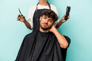 Young arab man ready to get a haircut isolated on blue background being shocked, she has remembered...