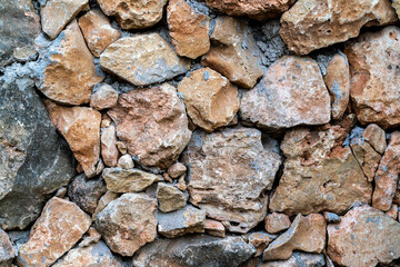 Modern seamless wall made of natural red and white stone, background and texture of old brick walls.