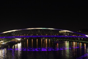 Fototapeta na wymiar night illumination of the Bernadka bridge over the Vistula in Krakow