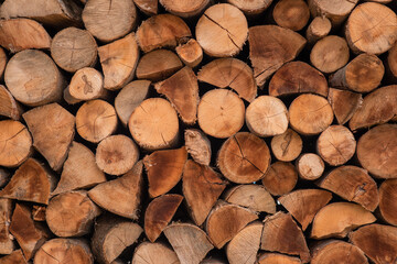Stacked firewood close up background. fireplace