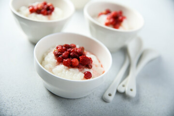 Traditional homemade rice pudding with wild strawberry