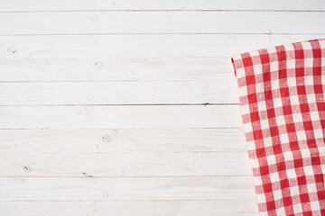 Red checkered tablecloth wooden background texture kitchen decoration
