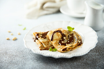 Homemade crepes with chocolate sauce