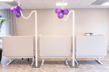 Stockholm, Sweden Purple balloons at a corporate launch party in an office.