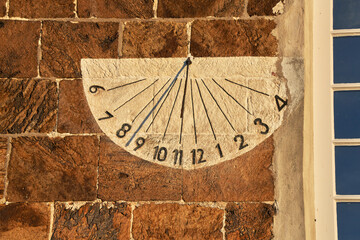 sundial on a wall of the historic church 