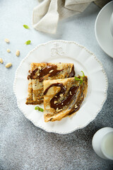 Homemade crepes with chocolate sauce