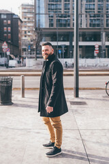 young successful businessman outdoors posing smiling and positive having fun happy