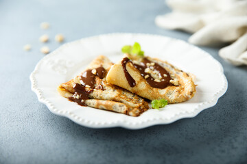 Homemade crepes with chocolate sauce