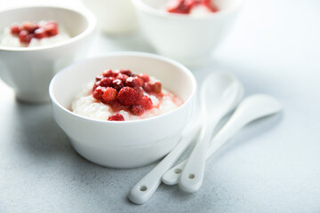Traditional homemade rice pudding with wild strawberry
