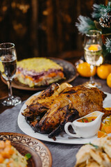 large and generously covered with delicious dishes table on which there are traditional New Year's dishes prepared on the table in the Soviet Union