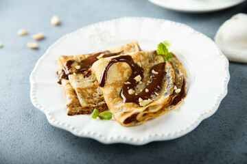 Homemade crepes with chocolate sauce