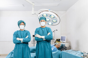 portrait of two surgeons standing in the operating room. Surgery and emergency concept