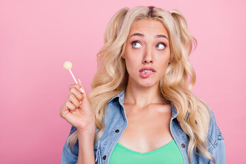 Photo of unsure blond millennial lady hold sweet look wear jeans shirt isolated on pink color background
