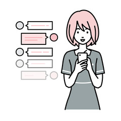 立ってスマートフォンで楽しくチャットで会話するエステ店員の女性