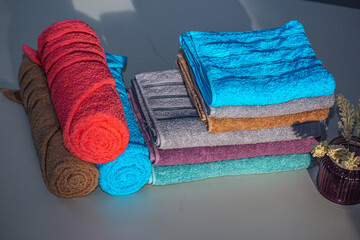 colorful towels on a bed