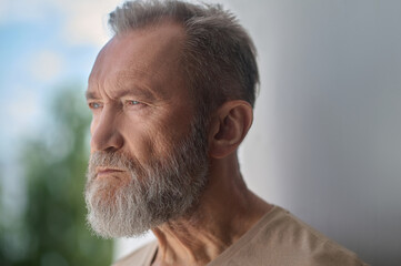 Obraz premium Sad gray-headed Caucasian man absorbed in thought