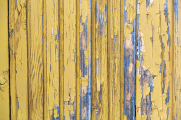 Old weathered board painted yellow