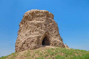 Facade of ancient Buddhist stupa Zurmala, Termez, Uzbekistan. Built in I-II AD of square bricks, originally painted red. Current height is about 39 feet