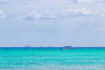 Obraz premium Boats yachts between Cozumel island and Playa del Carmen Mexico.