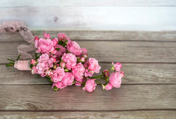 Beautiful Pink Roses Bouquet  on a Wooden Background  