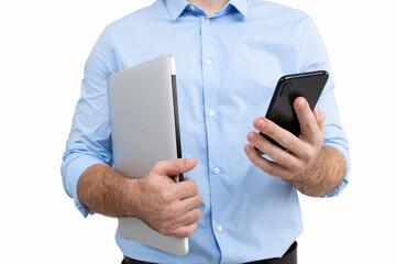 Portrait of a young guy in a business style who is talking on the phone on a white background